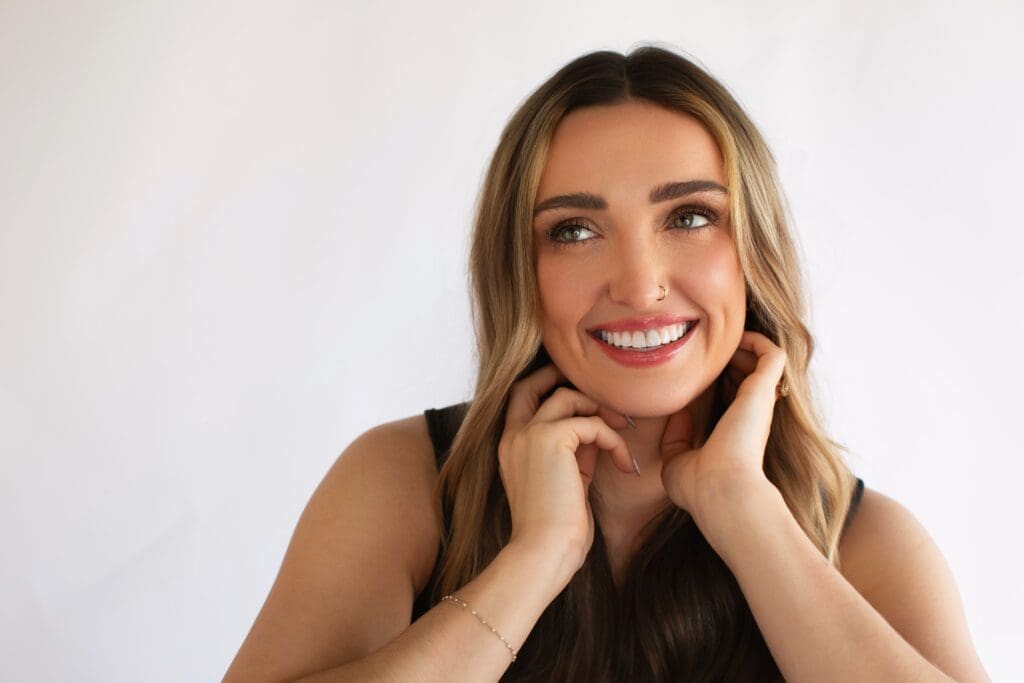 Smiling woman with clear, glowing skin after skin resurfacing treatment at The Injectables Lounge in Fishers Indiana